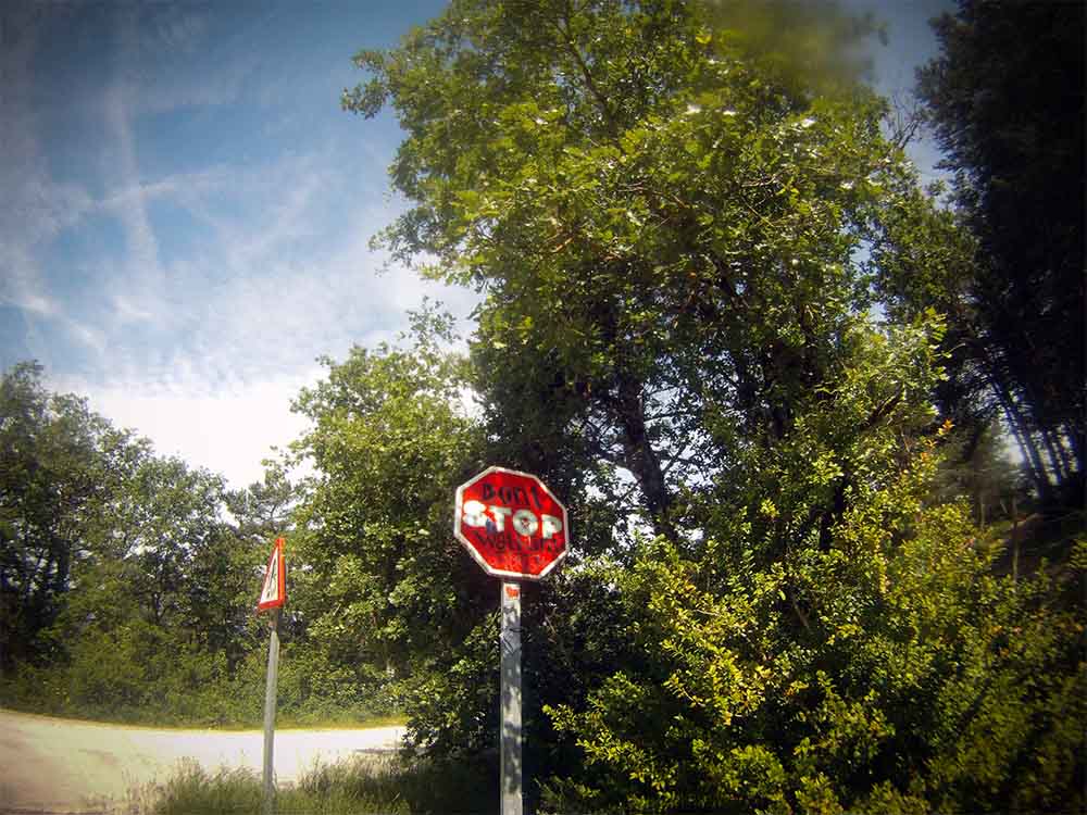 Defaced STOP sign.